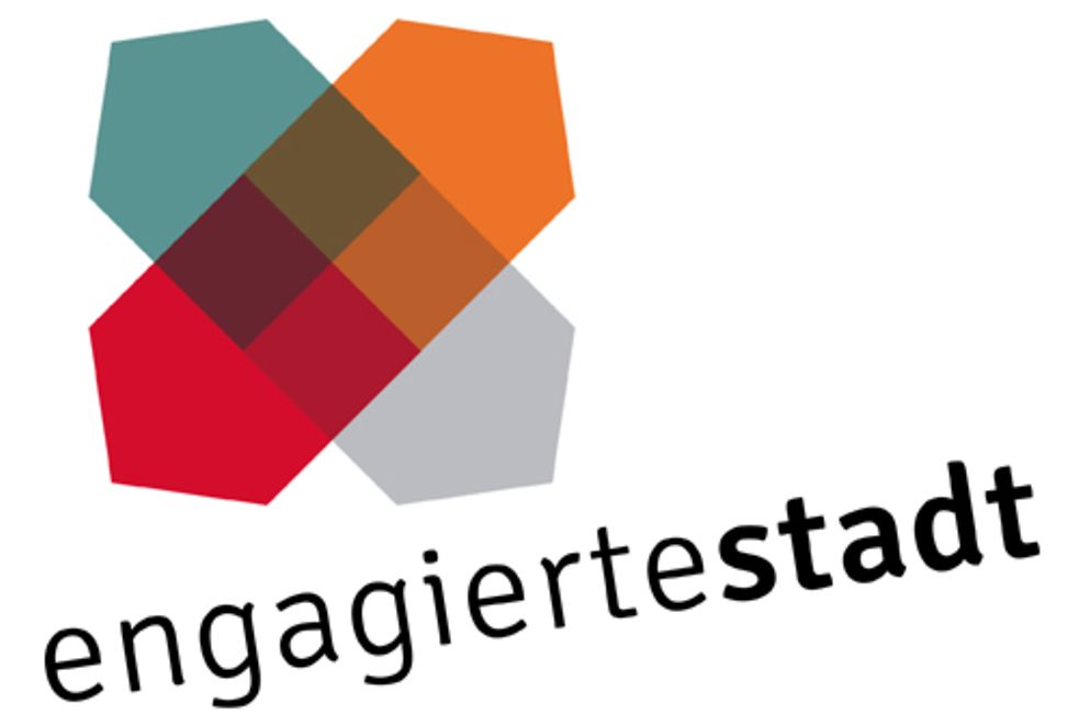 Vier Häuser in transparenten Farben - das Logo des Netzwerkprogramms "Engagierte Stadt"